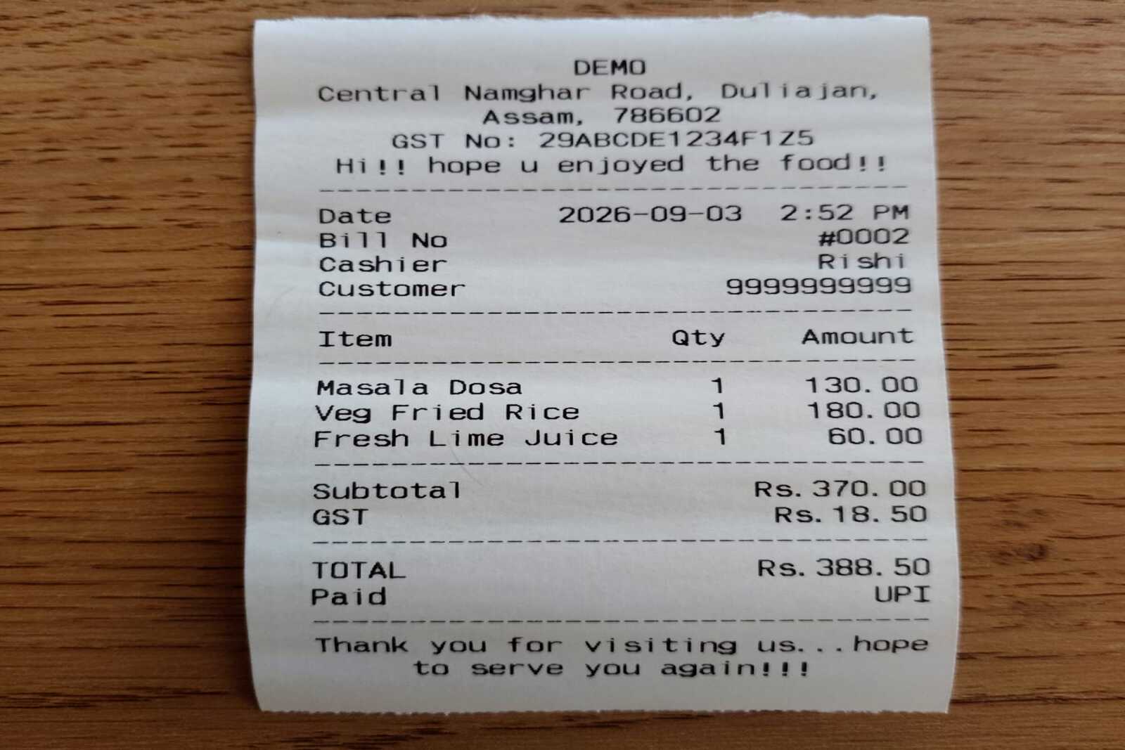A real receipt printed from the app, on the counter